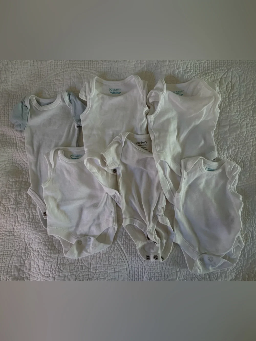 Carter’s & Primark assorted white short sleeved preemie onesies